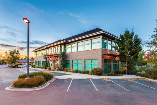 Parking lot and business with glass windows