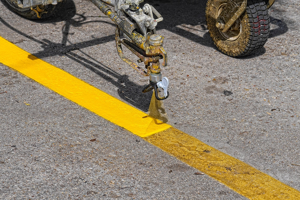 A Pro Stripe parking lot striping machine striping the parking lot